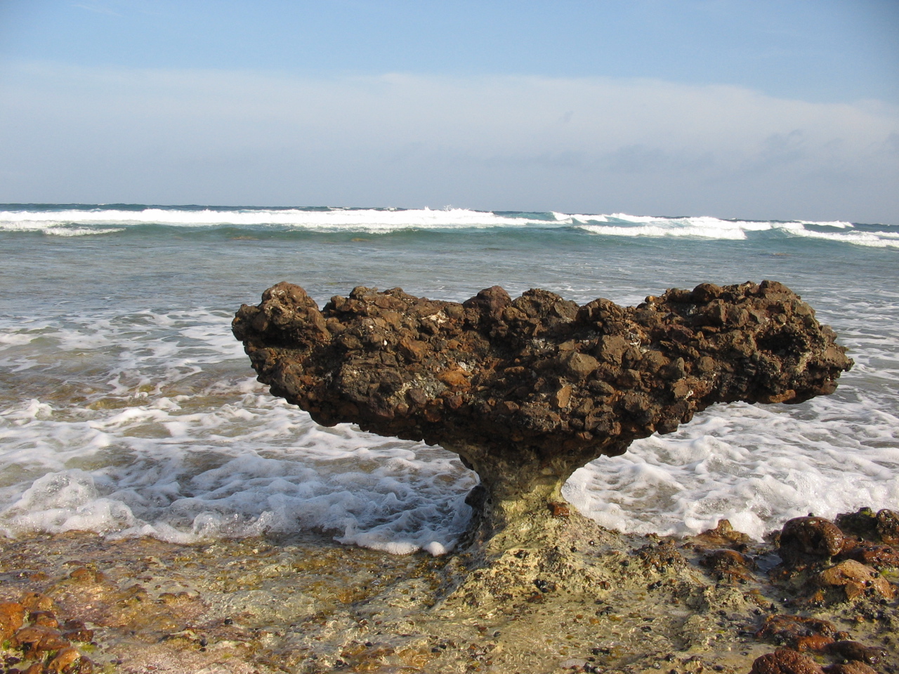 rock undermined by the waves